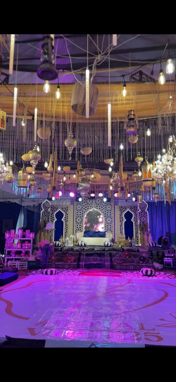 Luxury engagement decoration Lagos — floral arch and candlelit table setup