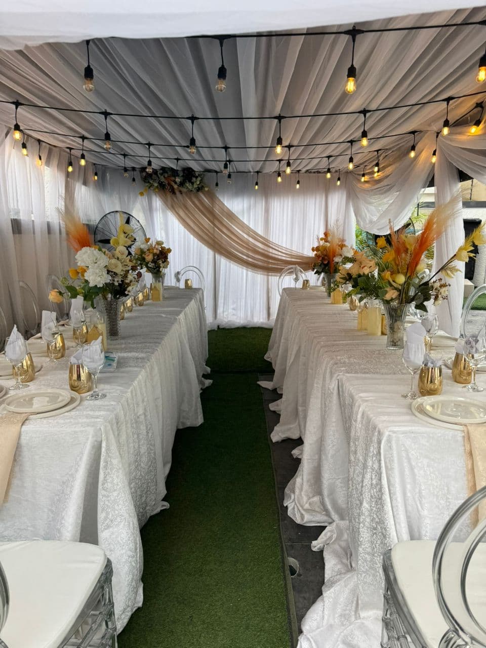 Nikkah decoration Lagos — elegant floral arch and ambient lighting